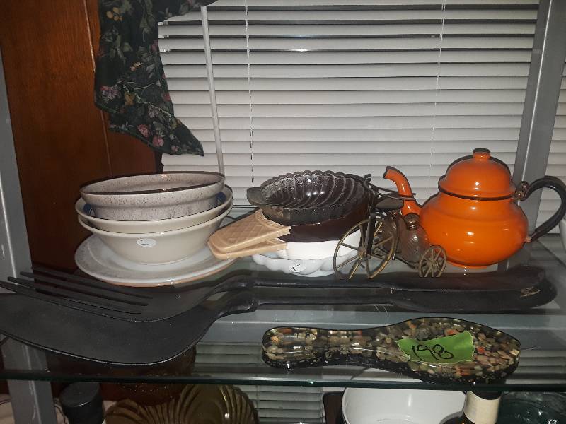 lot 198 image: Large metal fork and spoon, Ozark spoon rest, ceramic and glass bowls, ice cream bowls,  2 saucers, and one orange tea kettle