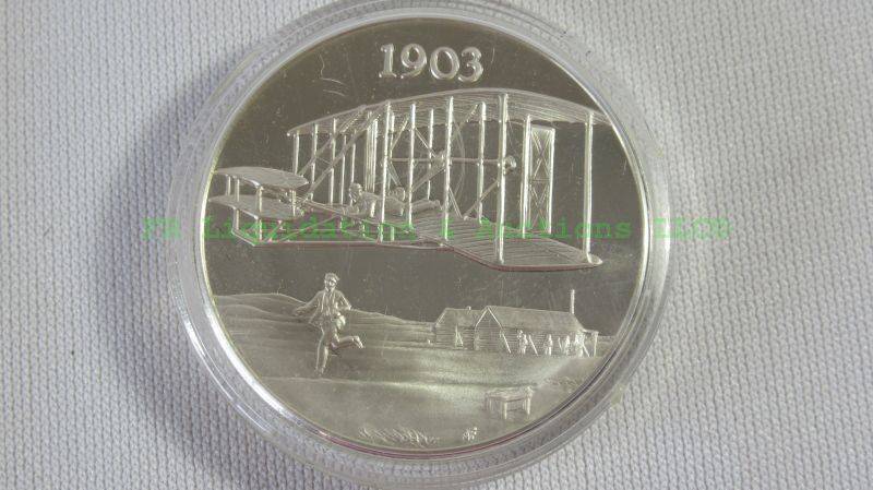 lot 31 image: Sterling silver 1 oz. Wright brothers 1903, commemorative coin