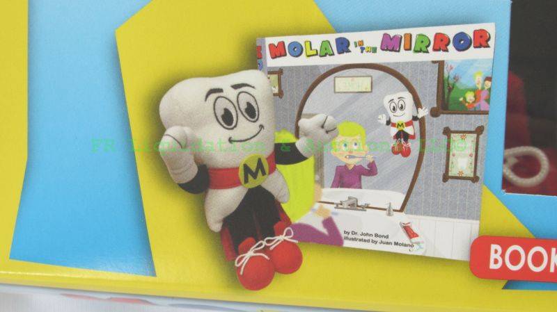 lot 53 image: Molar in the Mirror childrens dental promotional stuffed toy and book, new in box. Bulk lot of 100 unopened boxes. Bid is times the money per box