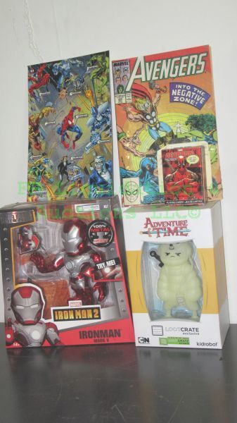 lot 56 image: Marvel Iron Man die cast character, Avengers comic book and Adventure Time Loot crate kid robot