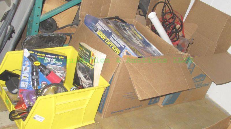 lot 94 image: Assorted automotive parts and manuals as shown, generous quantity