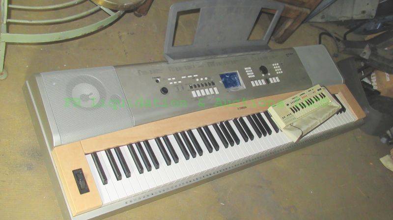 lot 121 image: Yamaha YPG-635 digital piano and Casio PT-20 hand held piano