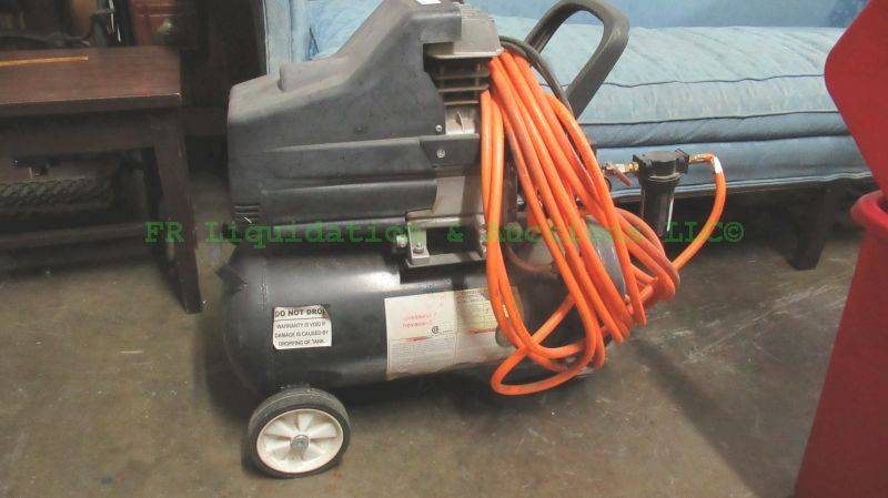lot 143 image: Central Pneumatics model 40400 air compressor with hose