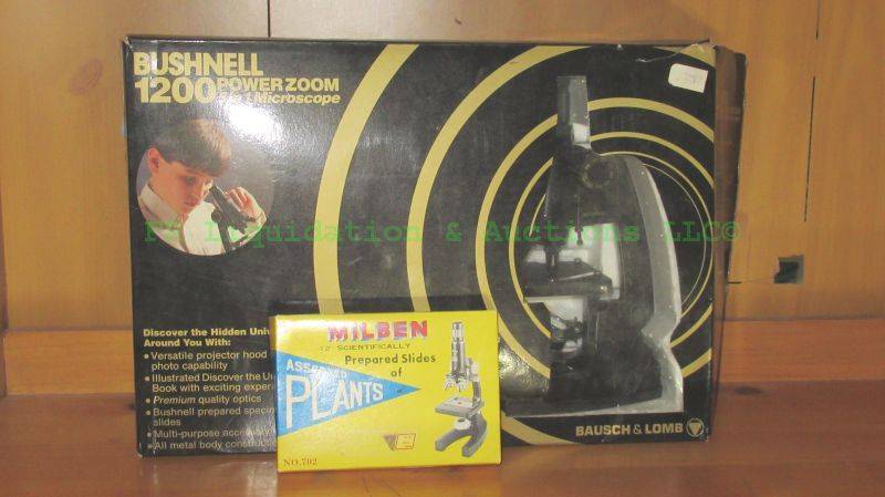 lot 210 image: Bushnell 1200 powerzoom 5 in 1 microscope and Milsen prepared plant slides