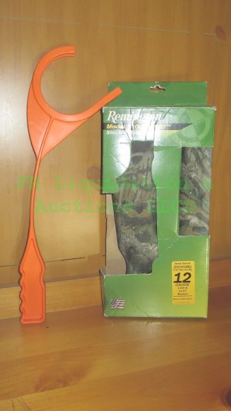lot 207 image: Remington model 1100 12 gauge shotgun camo synthetic stock set and clay pigeon thrower