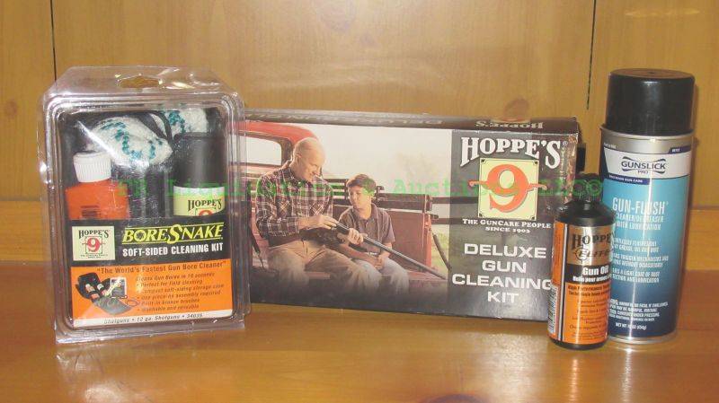 lot 206 image: Firearms cleaning kits and supplies including Hoppes 9 bore snake kit and deluxe cleaning kit and more as shown