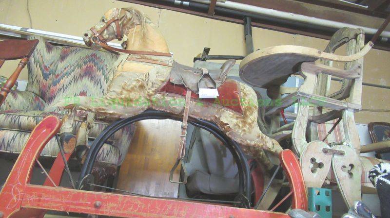 lot 309 image: Antique Victorian era Stean Co. rocking horse and antique Victorian era baby high chair (both in rough condition)