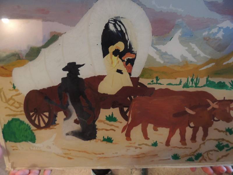 lot 20 image: ART WORK X 9- COWBOY WAGON TRAIL HAND PAINTED GLASS 14X18, ,Blueyellow Cowboy  hand painted glass Cowboy Carolyn Woodford, Umbrella Wooden Wheel 14x18 10 of 200 and more