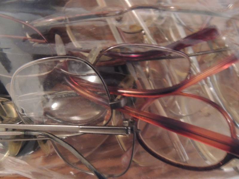 lot 34 image: Bag of glasses with glass cases- Foster grant, Lamy, dr dean Edel, etc.