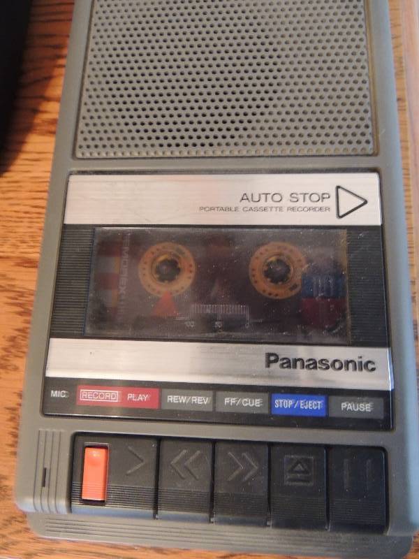 lot 40 image: Panasonic cassette player recorder, Gray clock, Westcloxx alarm clock, flash light, RCA remote, Toshiba remote, AC adapter etc.