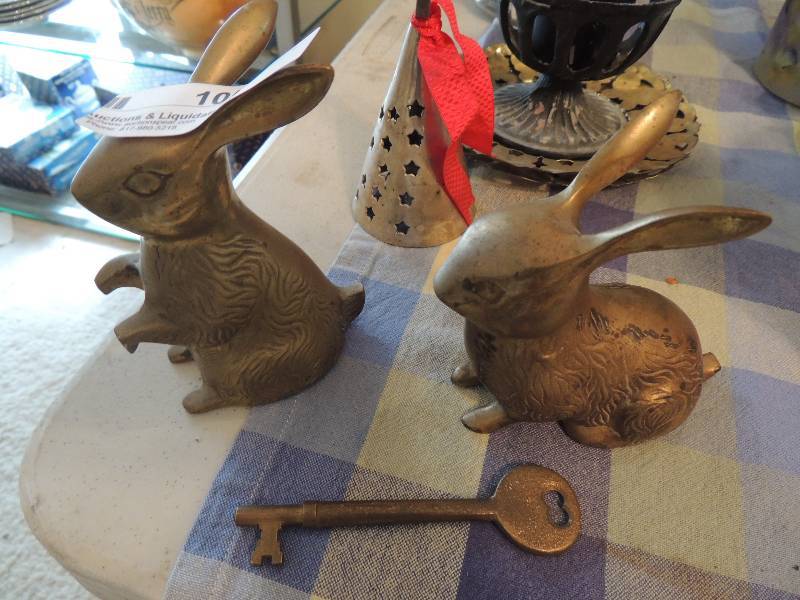 lot 105 image: Brass - Bunny Rabbits x 2, xmas bell,  Key, trays and candles