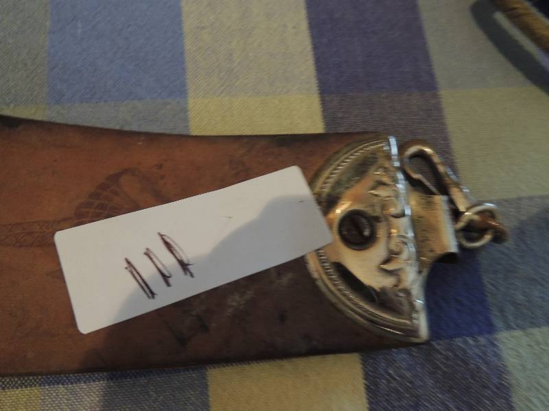 lot 111 image: Leather razor strap AND METAL HEART DECOR