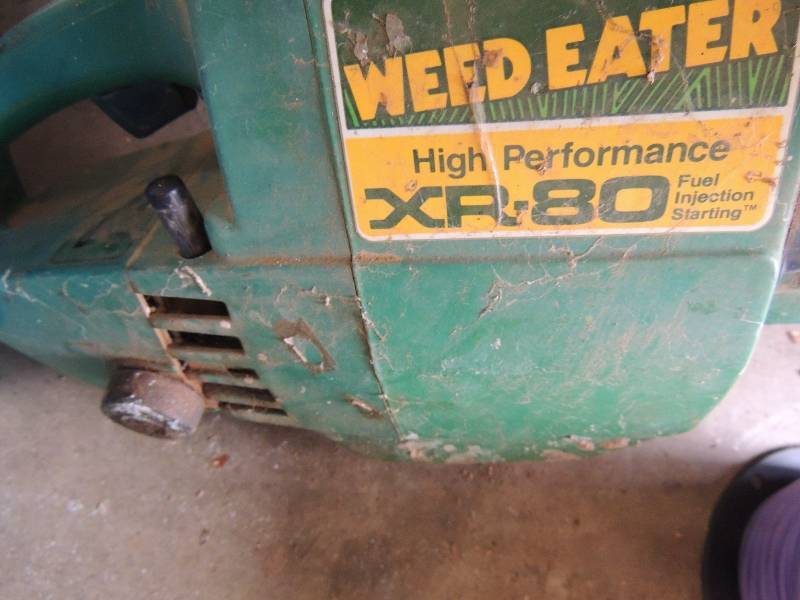 lot 197 image: Weed eater XR-80 and large roll of line