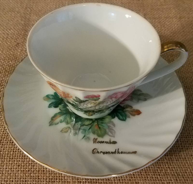 lot 33 image: NORCREST FINE CHINA LUSTERWARE TEACUP AND SAUCER