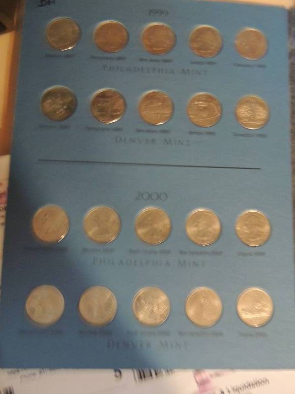 lot 8 image: Washington Quarters State Collection Book 1999-2003 Volume 1  contains 48 quarters. Missing Main 2003 and Ohio 2002
