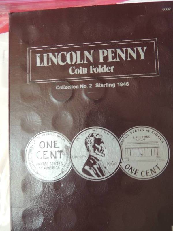 lot 36 image: Lincoln Head cent Folder 1946-1989. Contains 60 coins of set