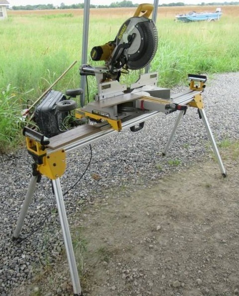 lot 5 image: DEWALT MITER SAW AND STAND