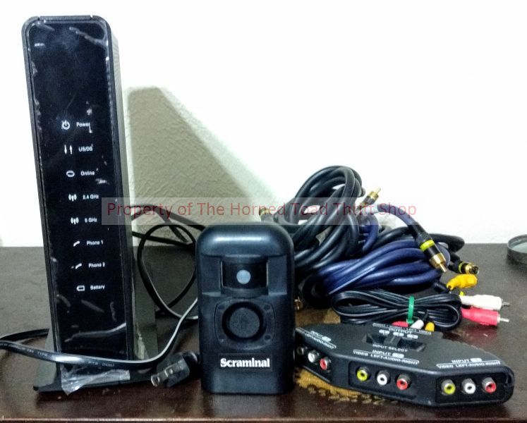 lot 115 image: Technicolor Modem, Scraminal, RCA Splitter, and Video and Audio Tributaries