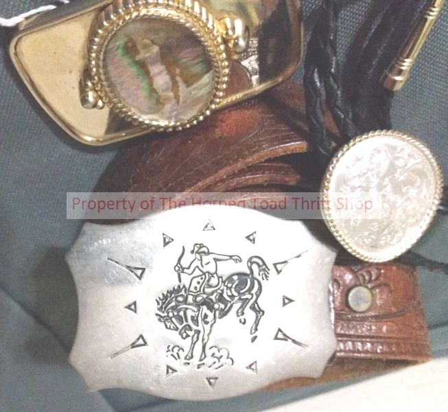 lot 149 image: Western Wear Buckles, Belt and a Bolo Tie