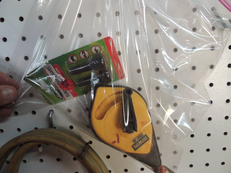 lot 21 image: Chalk line, tire valves, and chalk
