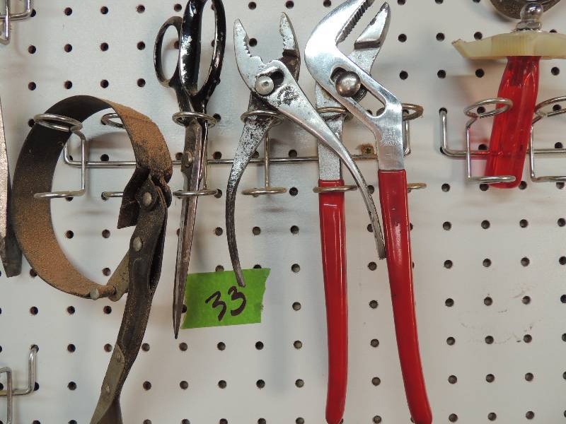lot 33 image: Long handeled pliers, short pliers, oil filter wrench, scissors and gage