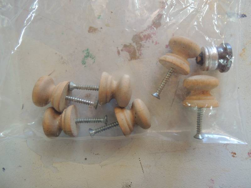 lot 76 image: Wooden drawer pulls x 6 and socket plugs