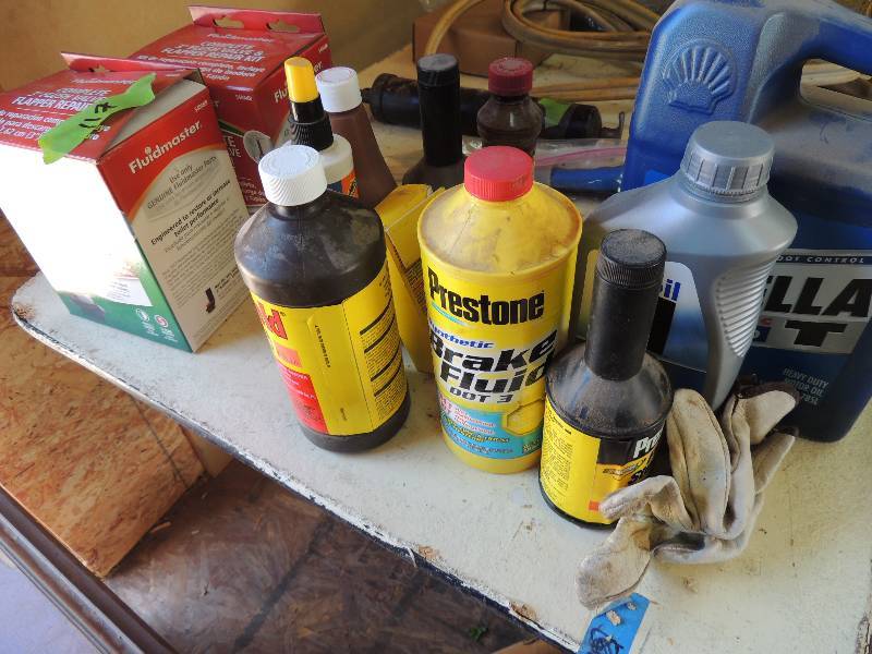 lot 122 image: Box of AUTOMOTIVE Fluids -Rotella , brake fluid, oils & more