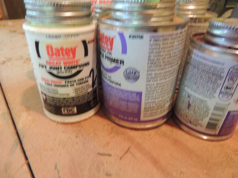 lot 187 image: 8 cans of cement primer and sealant for PVC pipes
