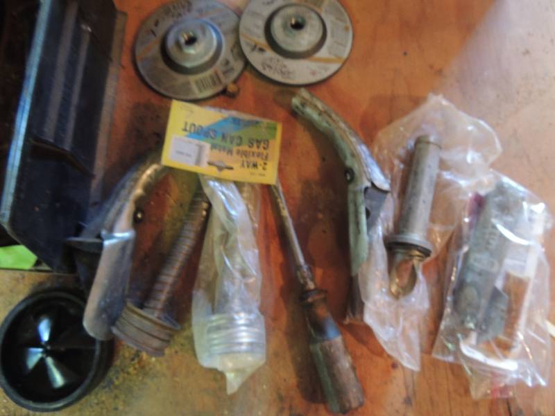 lot 196 image: 2 gas can tops, door knob workings, 3 vintage oil can spouts