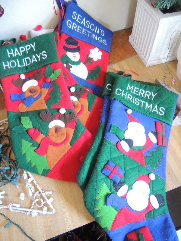 lot 220 image: 8 Lg. stockings, Santa hat, 4 small stockings and 3 med. Stockings