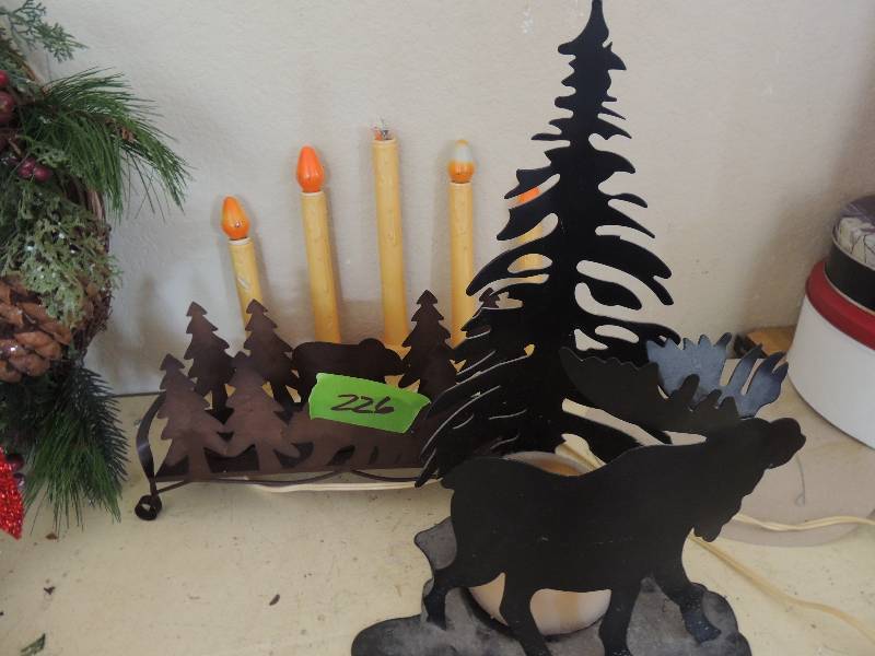 lot 226 image: Tin moose and pine candle holder Tin bear and pine candle holder