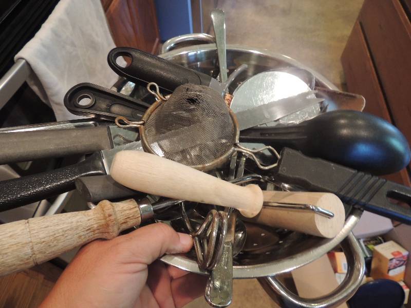 lot 316 image: silver strainer with lots of kitchen utensils