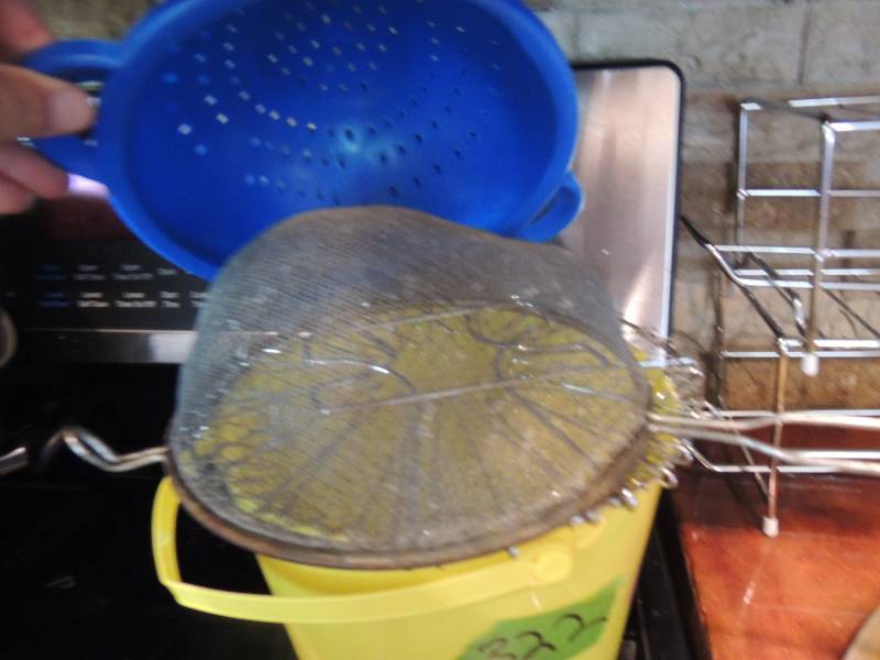 lot 322 image: 4 strainers and yellow bucket