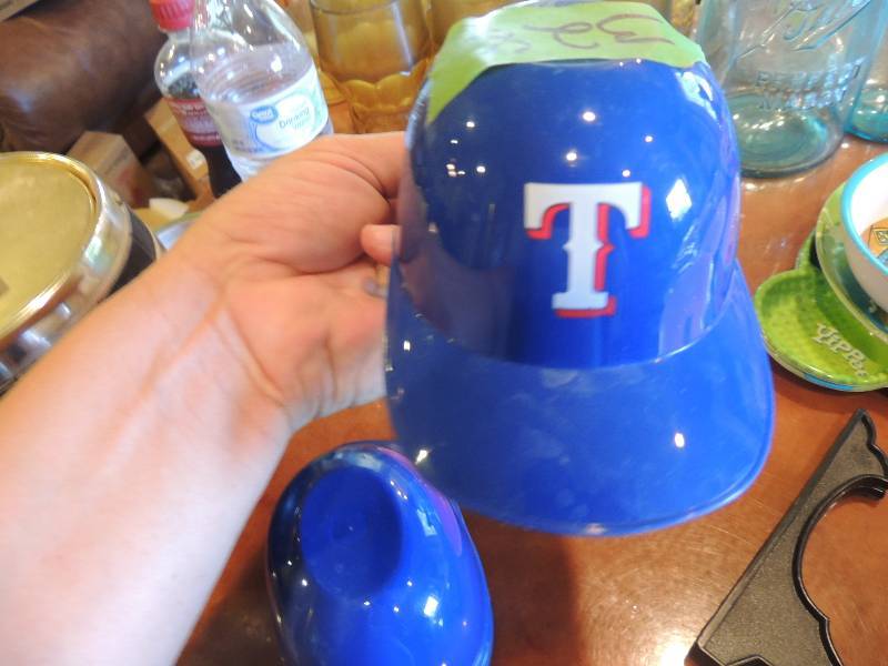 lot 328 image: 5 mini TX Ranger helmets, pink plate, white plate AND picture stand