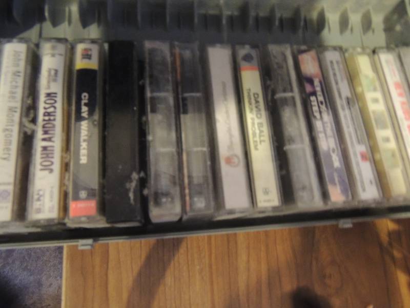 lot 365 image: case of cassettes x 15, 5 DVDs 7 VHS