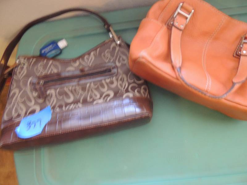 lot 377 image: 2 purses -  one leather fossil, ONE IS BROWN W HEART DCOR