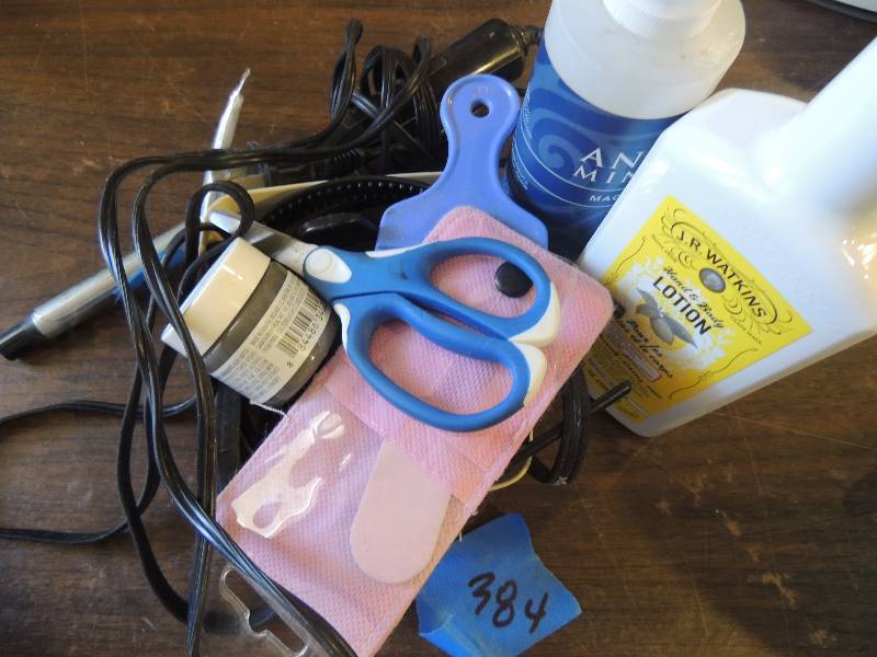 lot 384 image: Beauty supplies- curling iron, scissors, lotion, oil etc.