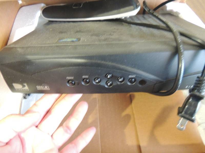 lot 395 image: Direct TV box with remotes