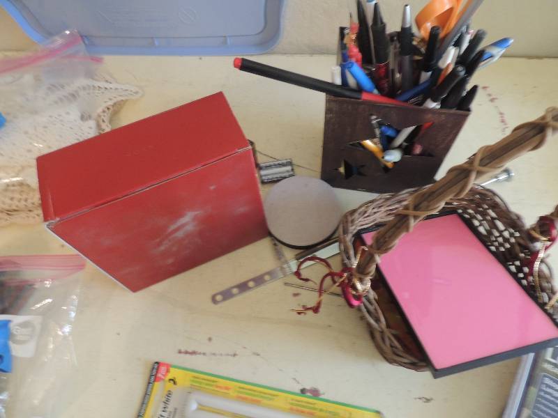 lot 433 image: Dog leader NIB, 7 year GE light bulbs, star box full of pens and pencils