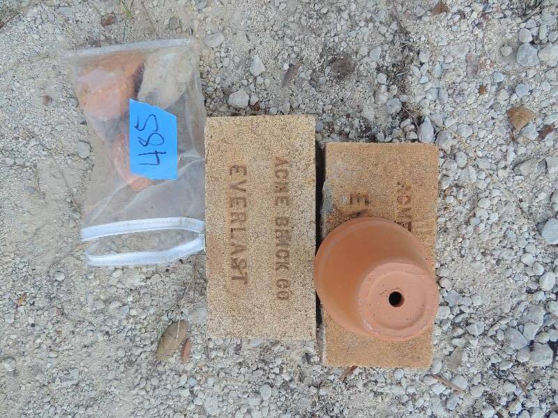 lot 485 image: 2 ACME brick company bricks and 3 very unique decorative rocks