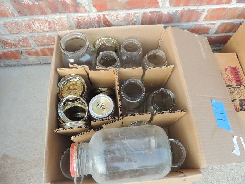 lot 517 image: 2 boxes of mixed size mason jars some with lids
