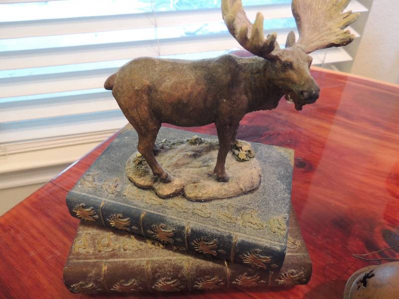 lot 518 image: Bell, moose on books, nice statue, Life book  A Time for Everything