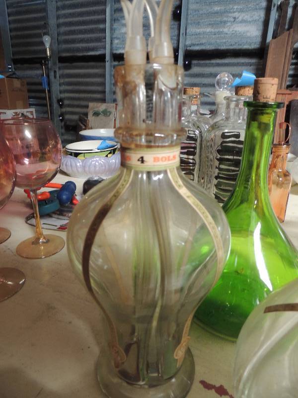 lot 383 image: 2 grape glass canisters, 2 ever lucas oil stands and green bottle with cork