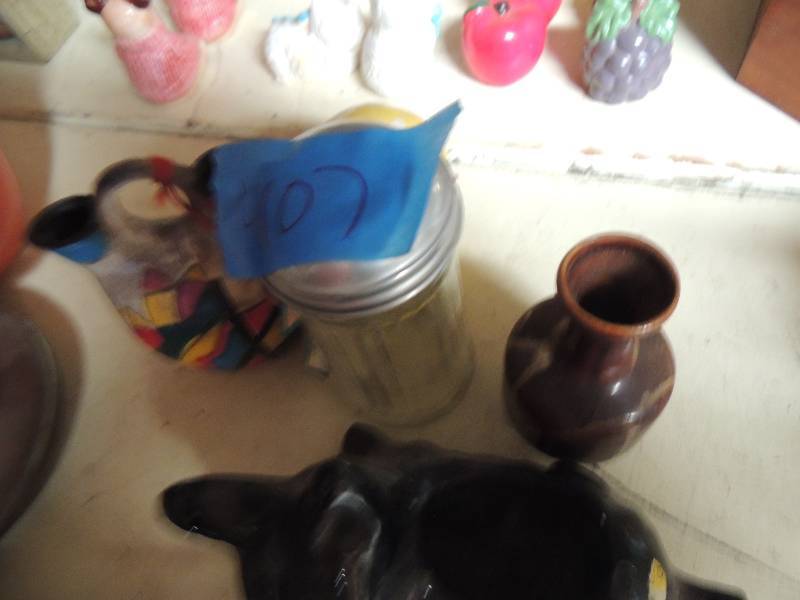 lot 407 image: Dog statue, african dcor and brown mug