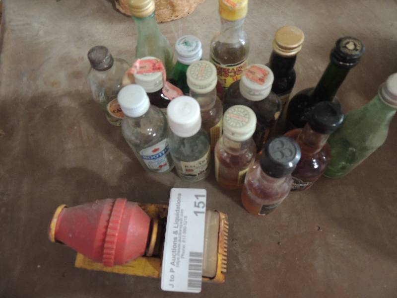 lot 151 image: Vintage metal cement truck and mini liquor bottles x 15