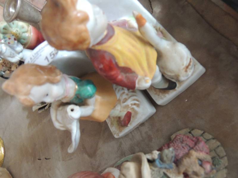 lot 153 image: 2 statues children holding a goose and 2 other glass figurines