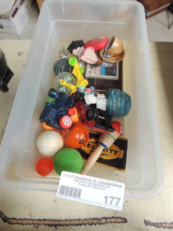 lot 177 image: Tub of toys, golf balls, tea cups and more