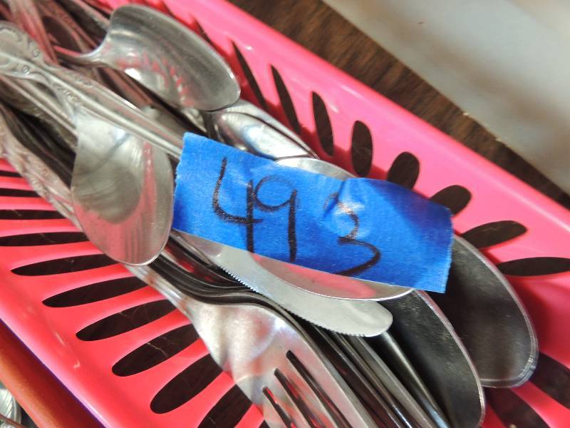 lot 493 image: Pink utencil holder full of Greenwich stainless steel pieces