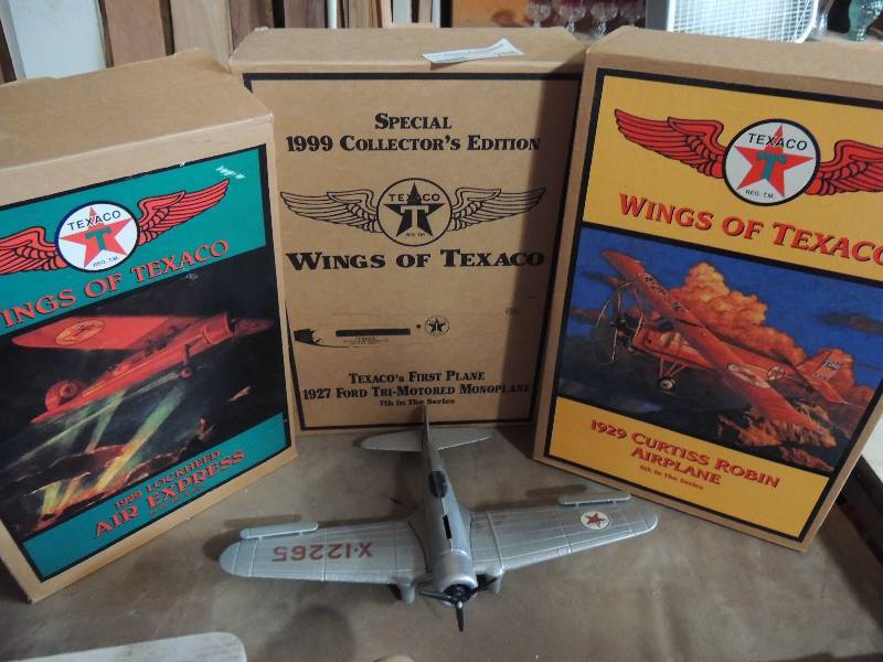 lot 288 image: Wings of Texaco model plane 1929 Lockheed Air express (1st in series) 1999 wings of Texaco model plane Ford tr-motored 7th in series and 1929 Curtis Robin Airplane Wings of Texaco 6th in series