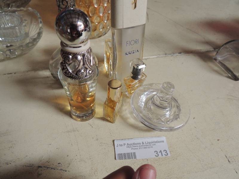 lot 313 image: Lot of perfume bottles some full some empty all different